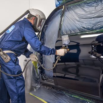 Rich's Auto Body - Painter applies paint to repaired vehicle - Body Shops Near Me - Merced, California Rich's Auto Body - Painter applies paint to repaired vehicle - Body Shops Near Me - Merced, California