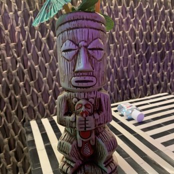 Run For The Roses - Tai One On: Their take on a mai tai (notice the idol is choking a beaver) - Cocktail Bars Near Me - Denver, Colorado Run For The Roses - Tai One On: Their take on a mai tai (notice the idol is choking a beaver) - Cocktail Bars Near Me - Denver, Colorado