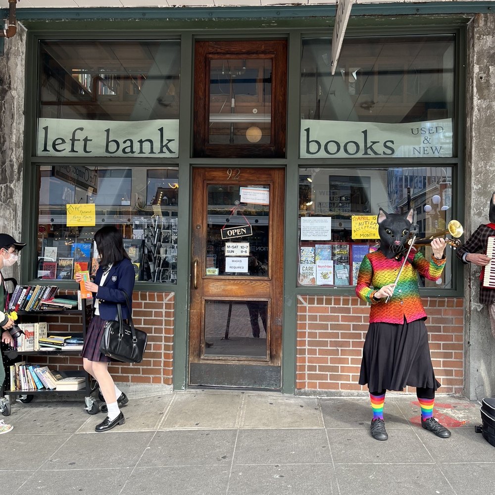 Left Bank Books Collective - People outside taking photos and making music. - Bookstores Near Me - Seattle, Washington Left Bank Books Collective - People outside taking photos and making music. - Bookstores Near Me - Seattle, Washington