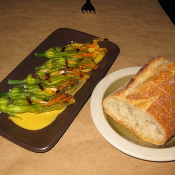 ZuZu - Grilled Squash Blossoms with Pepitas, Chevre & Quince-Membrillo over a Habanero Salsa - Tapas Bars Near Me - Napa, California ZuZu - Grilled Squash Blossoms with Pepitas, Chevre & Quince-Membrillo over a Habanero Salsa - Tapas Bars Near Me - Napa, California