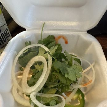 Viet-Nomz - A bowl from the herb bar containing onions and jalapeño, bean, sprouts, lime, and cilantro. - Vietnamese Near Me - Winter Park, Florida