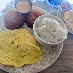 Salmon croquettes, eggs, rice and biscuit