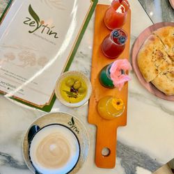 Zeytin - Menu, mimosa flight, complimentary bread and olive oil, cappuccino