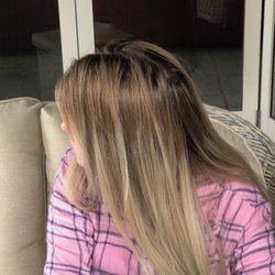 Royals Hair & Beauty - Copper band visible (sitting under cover), dark roots and blonde starts way down on head. Three visits. Over $1,000 last two visits alone.