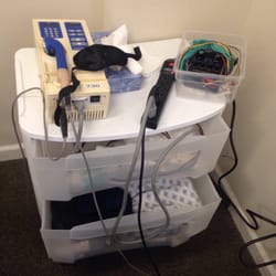 Kim Chiropractic & Acupuncture - Massage machine on plastic tote.