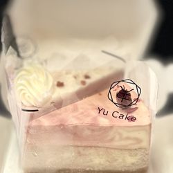 Yu Cake - Rose Double Cheesecake: Milk, egg, cake flour, cream, cream cheese, sugar, cookies, rose powder, rum.| $9.35/Slice