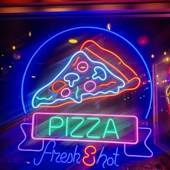Finas Trattoria - a slice of pizza in a neon sign - Pizza Near Me - San Pablo, California