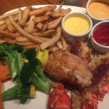 Outback Steakhouse - Crab cake filled lobster (limited time) & the sides were seasonal veggies and fries. Ranch, bloom sauce, and creamy lobster topping!! - Steakhouses Near Me - Bellevue, Washington Outback Steakhouse - Crab cake filled lobster (limited time) & the sides were seasonal veggies and fries. Ranch, bloom sauce, and creamy lobster topping!! - Steakhouses Near Me - Bellevue, Washington
