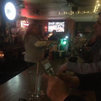 Tin Dog Saloon - a man and a woman at a bar - Dive Bars Near Me - Tulsa, Oklahoma Tin Dog Saloon - a man and a woman at a bar - Dive Bars Near Me - Tulsa, Oklahoma