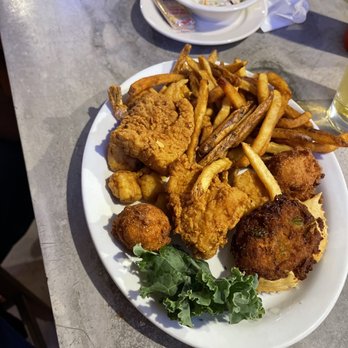 Capt's Table - Seafood platter....delicious!!! Fish shrimp scallops deviled crab fries and hush puppies! - Seafood Near Me - Panama City, Florida
