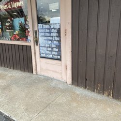 Olde Town Spirits - Front door with hours posted