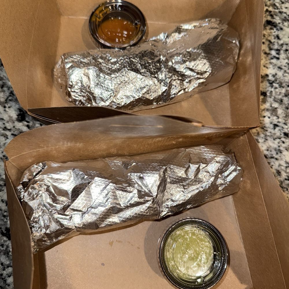La Ciudad - Two breakfast burritos. One chorizo and egg. The other ham, bacon and eggs. - Breakfast & Brunch Near Me - West Sacramento, California La Ciudad - Two breakfast burritos. One chorizo and egg. The other ham, bacon and eggs. - Breakfast & Brunch Near Me - West Sacramento, California