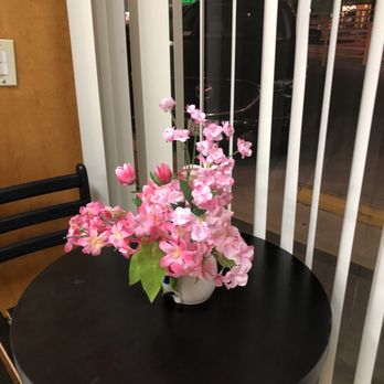 Shrini Sara French Bakery - a black table with pink flowers - Bakeries Near Me - Encino, California Shrini Sara French Bakery - a black table with pink flowers - Bakeries Near Me - Encino, California