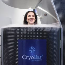 The CryoBar West Loop - Owner Sara Latham in the whole body cryotherapy sauna.