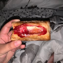 a person holding a piece of food