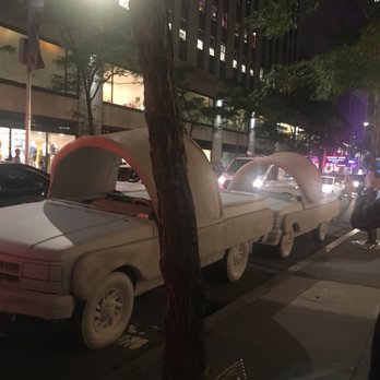Rockefeller Center - Yeezy slides with parking violation ticket at the dash - Shopping Centers Near Me - New York, New York