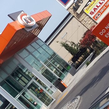 A&W - the reflection of a car in a puddle - Fast Food Near Me - Brampton, Ontario
