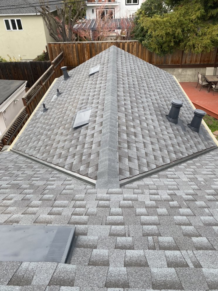 Slide of Mel's Roofing