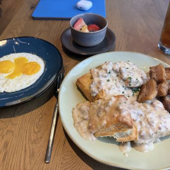 Hearth and Hill - Biscuits and Gravy with 2 eggs and fruit, plus side of yummy, crispy pork belly! - New American Near Me - Salt Lake City, Utah Hearth and Hill - Biscuits and Gravy with 2 eggs and fruit, plus side of yummy, crispy pork belly! - New American Near Me - Salt Lake City, Utah