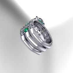 Y Sadiq Diamond - 5.70ct Platinum with 2.00ct Oval center
marriage of diamonds & emeralds with a European shank (square at bottom).