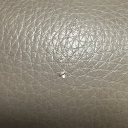 La-Z-Boy - A tear in the arm of our new leather chair caused by a ring.
