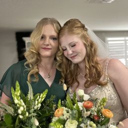 Hair done for both bridesmaid and bride Hair done for both bridesmaid and bride