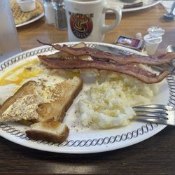 Waffle House - Over easy eggs, bacon, grits, toast