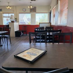 South Pacific Bistro - Tables inside the restaurant, there's more tables to the left. The dining room is "L" shaped.