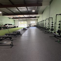Driven Strength Club - Inside of the gym where there are no large crowds. Very clean, organize and sleek.