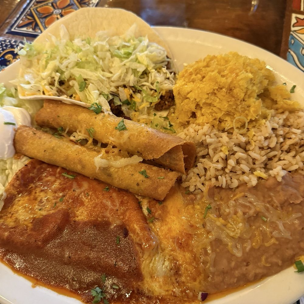 Arriba Tortilla - Combo platter. Two taquitos, one enchilada, one taco with rice and beans. - Mexican Near Me - East Aurora, New York