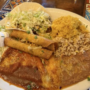 Arriba Tortilla - Combo platter. Two taquitos, one enchilada, one taco with rice and beans. - Mexican Near Me - East Aurora, New York