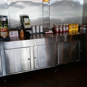 Olive Burger - A very tidy and organized condiment and drink area. - Burgers Near Me - Richardson, Texas Olive Burger - A very tidy and organized condiment and drink area. - Burgers Near Me - Richardson, Texas