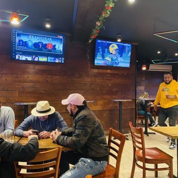 Merengue Restaurant - a group of people sitting at a table - Dominican Near Me - Stamford, Connecticut Merengue Restaurant - a group of people sitting at a table - Dominican Near Me - Stamford, Connecticut