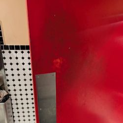 Freddy's Frozen Custard & Steakburgers - Bathroom door with dirt on it