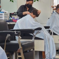 Royal Barber Shop - Getting his hair cut 