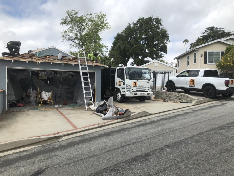 Slide of Reno's Roofing