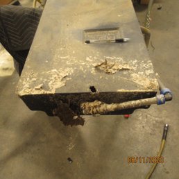 Picture of hole in black water tank after repair shop removed it from RV I purchased at Cassone's.