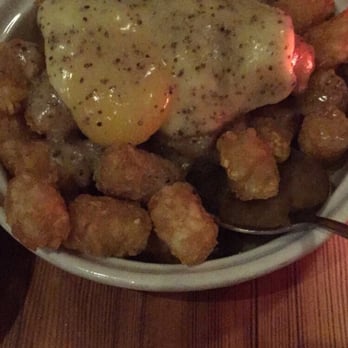 Radiator Whiskey - Tater tots with eggs and gravy. - New American Near Me - Seattle, Washington