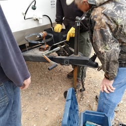 Lost Alaskan Rv Park - Friendly neighbors from Minnesota and maintenance guy from Alaska pitching in.