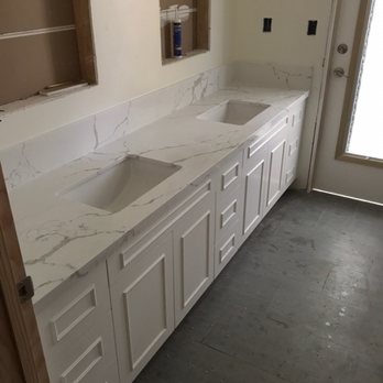 Liquorish stone and tile - two sinks in a bathroom - Tiling Near Me