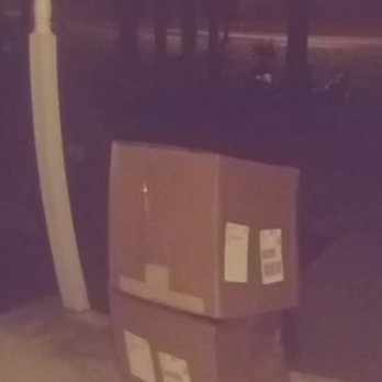 FedEx Ship Center - This is how FedEx leaves 2 40lb boxes on a covered porched but on the edge to get rained on - Shipping Centers Near Me - Crofton, Maryland