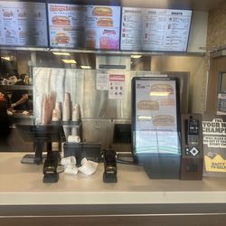 Burger King - Ordering kiosk area and menu in the background