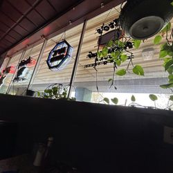 AJ’s Hideaway Bar & Grill - Real plants and signs