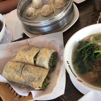 Noodle St - Front: beef rolled pancake & dan dan noodles w/ small flat noodles; back: spicy beef noodles w/ triangle noodles & spicy pork buns - Noodles Near Me - Fullerton, California Noodle St - Front: beef rolled pancake & dan dan noodles w/ small flat noodles; back: spicy beef noodles w/ triangle noodles & spicy pork buns - Noodles Near Me - Fullerton, California