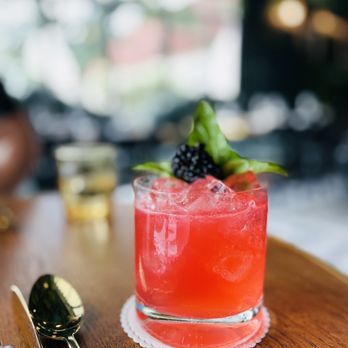 Lutie’s - Indigo Kick: Vanilla Infused Ketel One, Blackberry Basil Shrub, Local Honey, Lemon, Ginger Beer - Modern European Near Me - Austin, Texas