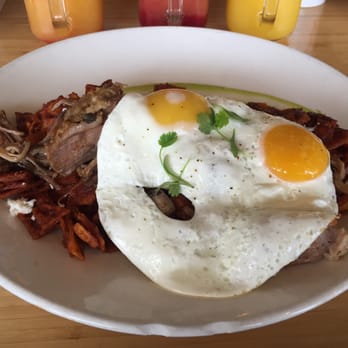 Early Bird - Carnitas chilaquiles w/ sunny side up eggs - New American Near Me - Fullerton, California Early Bird - Carnitas chilaquiles w/ sunny side up eggs - New American Near Me - Fullerton, California