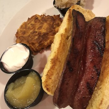 Myron's - Well done all beef hot dog with sauerkraut and a side potato pancake with sour cream and applesauce. - Delis Near Me - Pompano Beach, Florida Myron's - Well done all beef hot dog with sauerkraut and a side potato pancake with sour cream and applesauce. - Delis Near Me - Pompano Beach, Florida