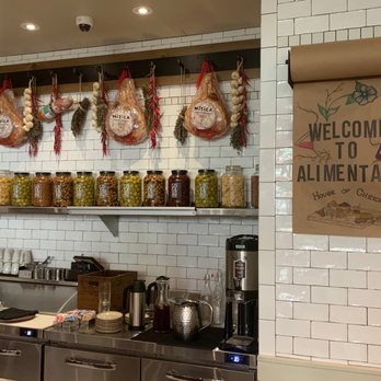 Alimentari  - Bar area with jars of olives and hanging prosciutto - Wine Bars Near Me - Philadelphia, Pennsylvania