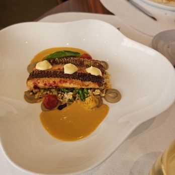 Le Pavillon - Lunch- Grilled Black Seabass- Demi-sec tomatoes, eggplant, Carolina gold rice, sauce bourride. They liked it - French Near Me - New York, New York