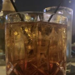 Angel Envy Bourbon served with large ice cube.